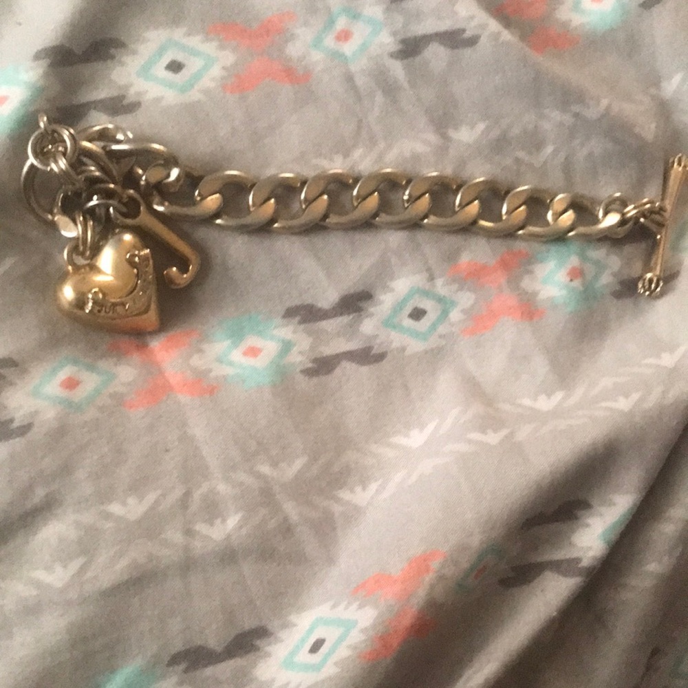 This is a gold bracelet in good condition a charm bracelet